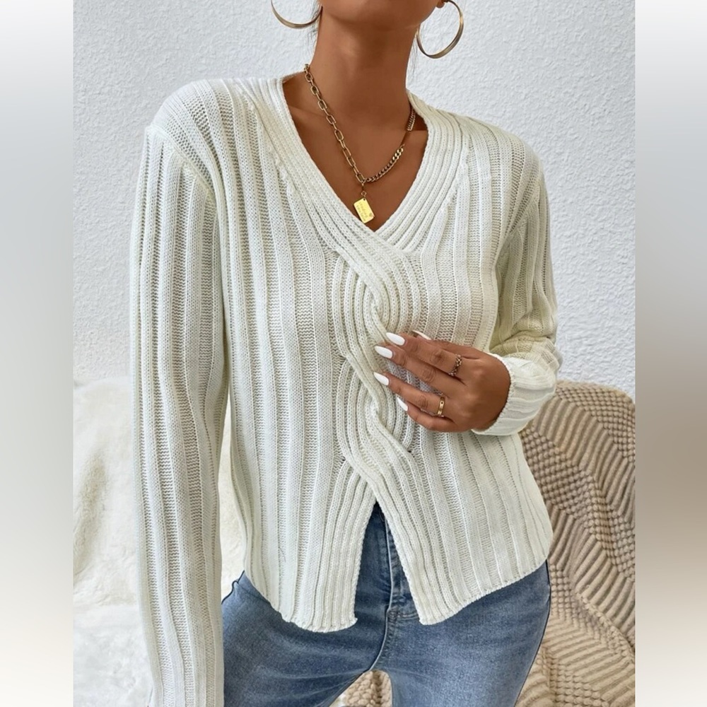 Cross wrap slit cable knit sweater